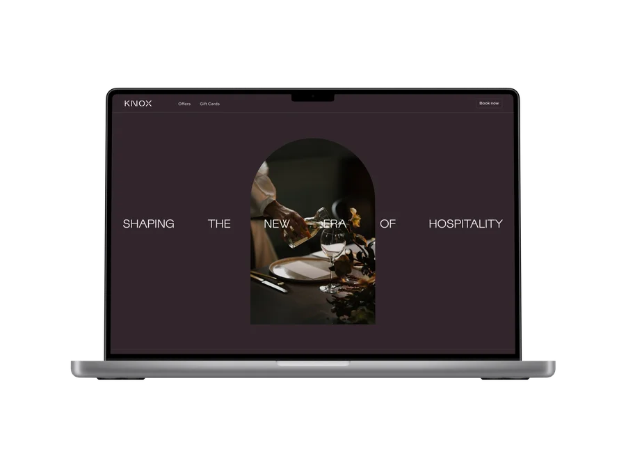 Custom hotel website shown on a laptop